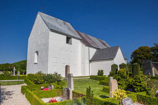 Cemetary and historic white church in Jelling, Denmark