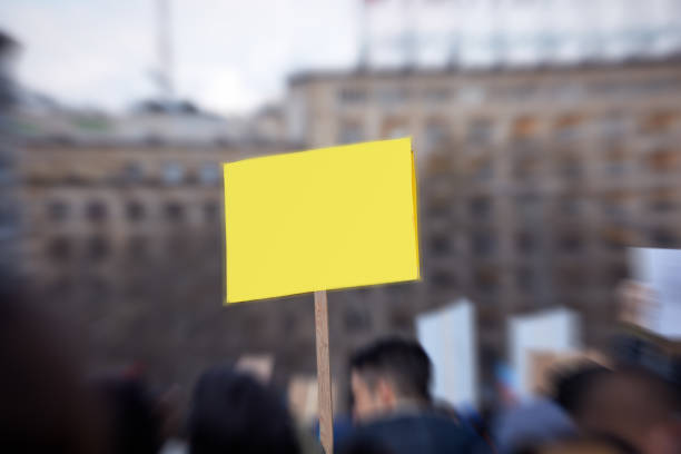 istock Protesters holding placards and signs on the streets. 1342404993