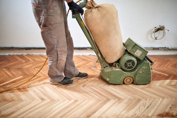 istock Repairman restoring parquet with a sanding machine. 1342405100