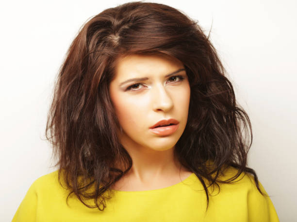 istock Young woman l looking at camera over white background 1342406486