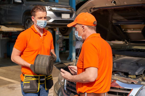 istock Mechanics checking maintainance a pickup truck by replace air fi 1342406833