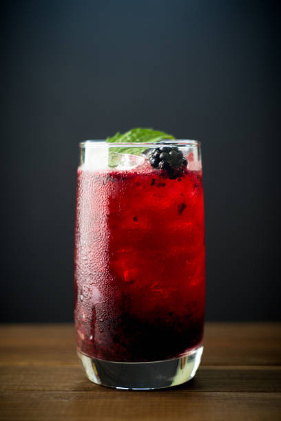 istock Blackberry cocktail with crushed ice on the rustic wooden background. Selective focus. Shallow depth of field. 1342409511
