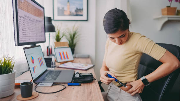 COVID-19 Working from home and diabetes management stock photo