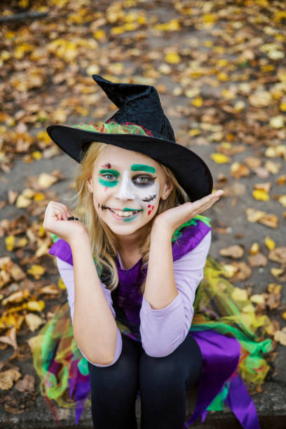 istock A girl in a witch costume for Halloween 1342413921