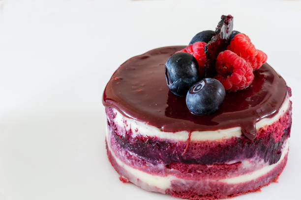 istock French dessert. Opera cake filling with currant jam and decorated with berries 1342414484