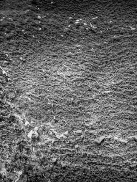 istock Dark water and sand abstract texture - background 1342414543