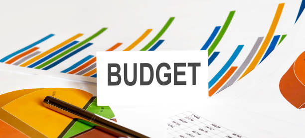 istock BUDGET text on paper on chart background with pen 1342415159