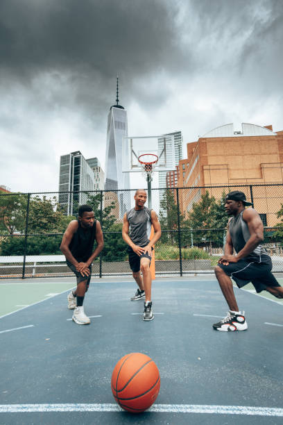 istock teamwork of basketball player in nyc 1342415218