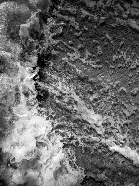 istock Dark water and sand abstract texture - background 1342418910