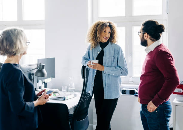 istock Businesspeople having casual discussion during break 1342419226
