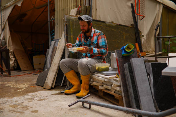 istock Stonecutter at the workshop, having a lunch break 1342422558