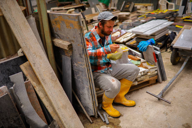 istock After a hard working day at workshop, stonecutter having a quick lunch break 1342422588