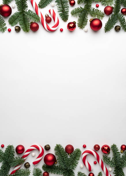 istock Frame of Christmas tree ornaments on a white background 1342424751