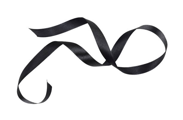 istock Waved black silk ribbon isolated on white 1342424792
