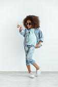 istock Beautiful stylish little girl in denim clothes 1342428711