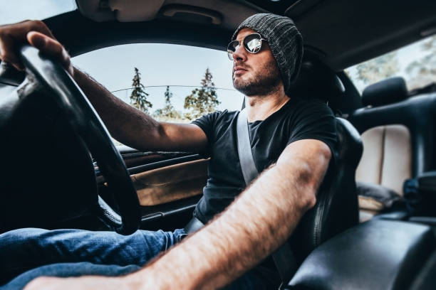 istock Caucasian man driving car interior view 1342431851