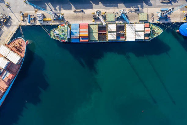 istock Container ship loading and unloading in deep sea port, Aerial view business commercial trading 1342432972
