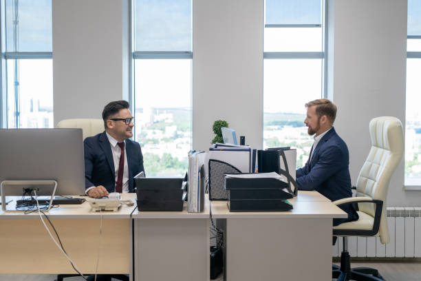 istock Two confident businessmen working in office 1342438478