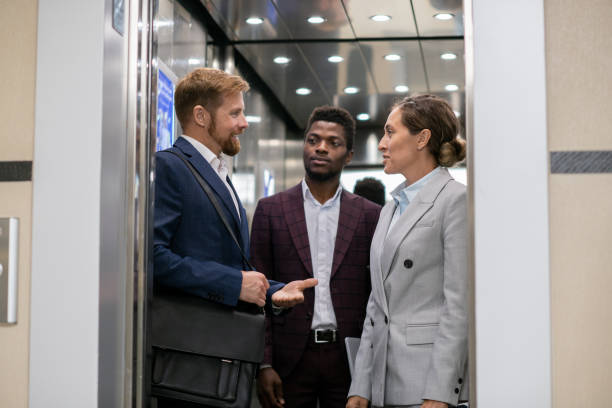 istock Young African businessman looking at his interacting colleagues 1342438538