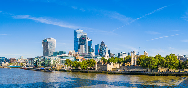 A panoramic shot of the Tower Bridge on the river Thames under a blue clear sky, London