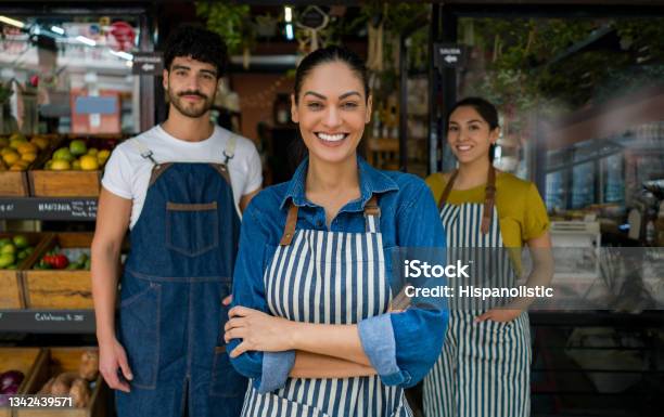 Woman Leading A Group Of Salespersons Working At A Food Market Stock Photo - Download Image Now