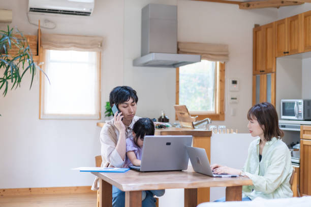 istock A couple and their child teleworking 1342439798
