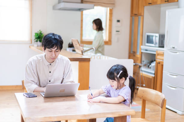 istock A couple and their child teleworking 1342439801
