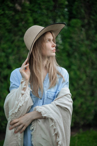 istock Romantic girl with hat on picnic in park 1342445687