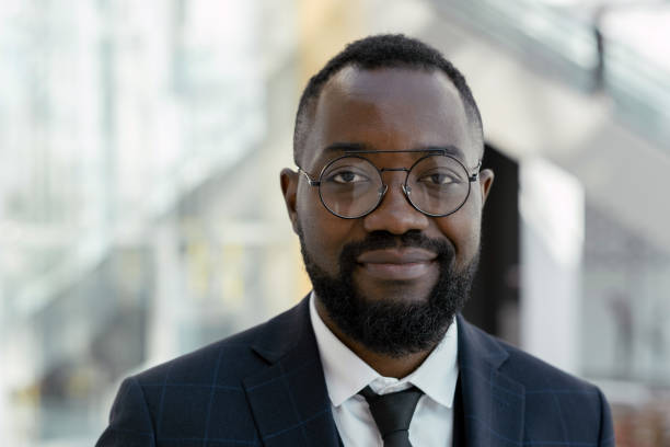 istock Young smiling man in eyeglasses and elegant suit 1342449494