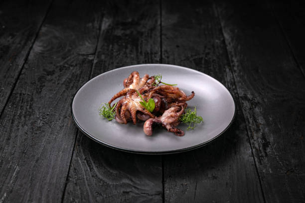 istock grilled seafood in a gray round plate 1342449741