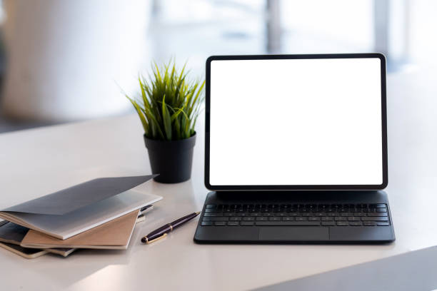 istock Desk had tablet blank white screen with documents placed in the office. 1342450814