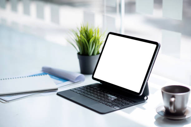 istock Digital tablet blank white screen on the desk. Mock up. 1342450954