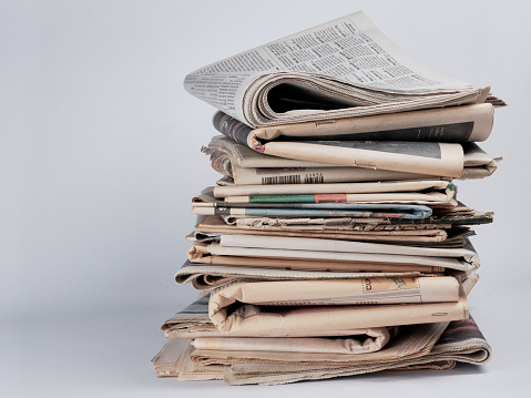 Pile of newspapers on white background. Journalist, isolated. Information. Stack