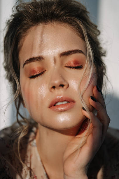 istock Closed Eyes Model Girl Touching Face with Hand 1342457508