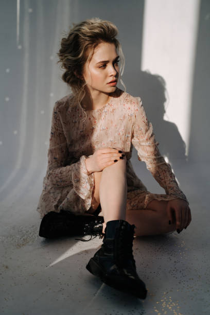 istock Resentful Woman Sitting on Floor Looking Away 1342457523