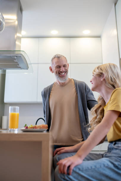 istock A father and a daughter in the kitchen having breakfast 1342457958