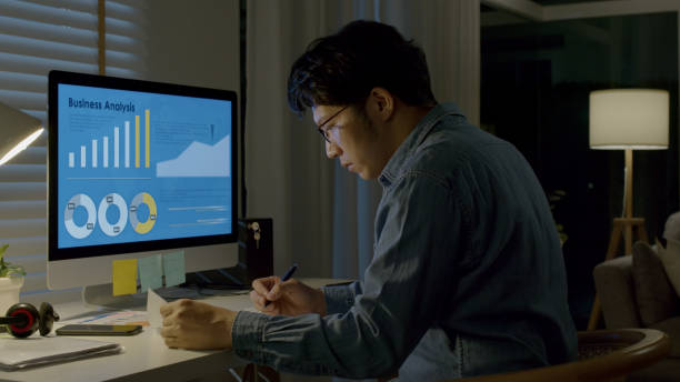 istock Asian man hard working at home,thinking and feeling thoughtful.Working from Home overload at night, self isolation in new normal concept.Working late and Overtime 1342458873