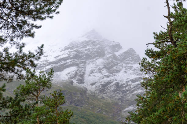 peaks of the Caucasus mountains in autumn in haze stock photo