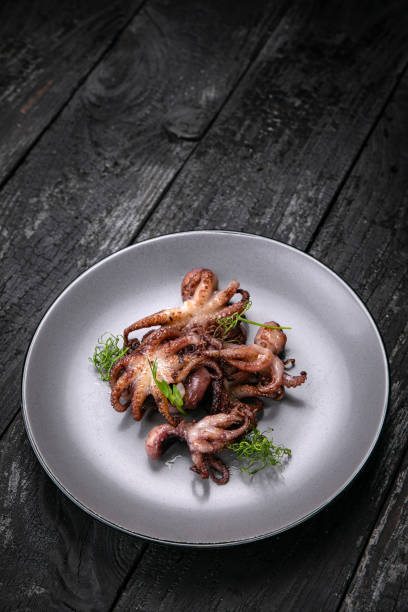 istock grilled seafood in a gray round plate 1342463921