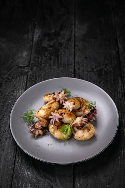 istock grilled seafood in a gray round plate 1342464095