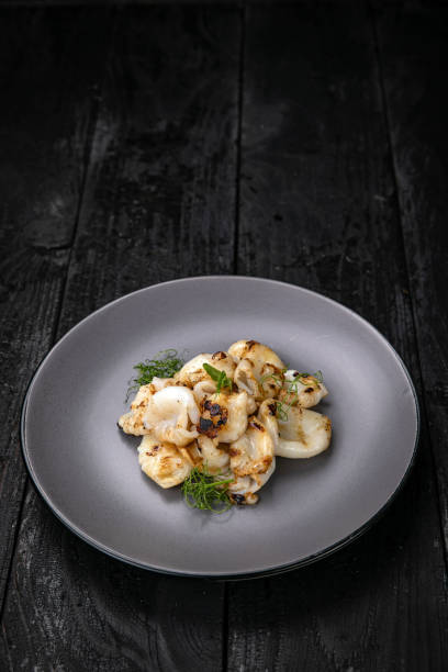 istock grilled seafood in a gray round plate 1342464160