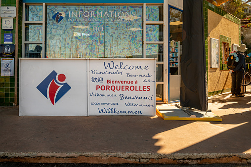Porquerolles, Var, France: Welcome to Porquerolles panel sign. Welcome messages in many different written languages. Sign.