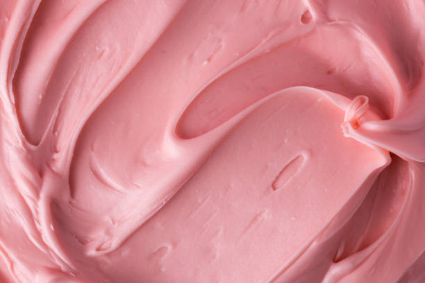 textura de glaseado rosa glaseado de cerca - cake fotografías e imágenes de stock