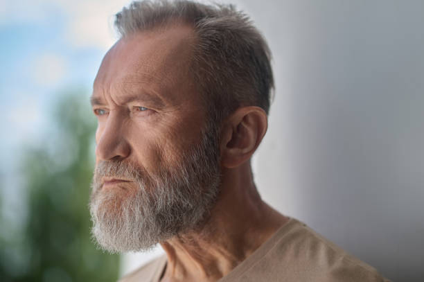 istock Sad gray-headed Caucasian man absorbed in thought 1342473965