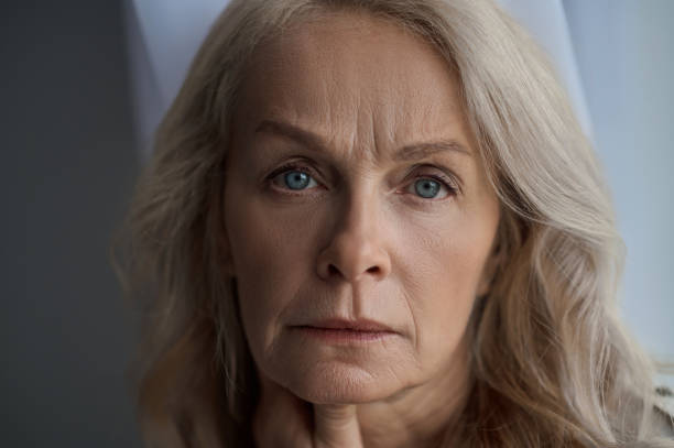 istock Depressed mature lady posing for the camera 1342473995
