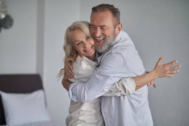 istock Happy romantic mature couple embracing one another 1342474036