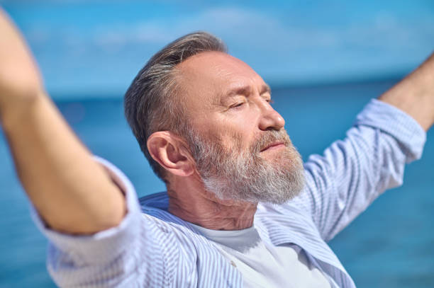 istock Serious man in harmonious mood outdoors 1342474063