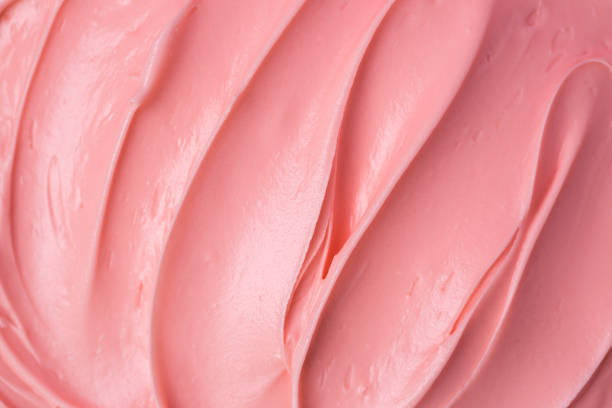 istock Pink icing frosting close up texture 1342475103