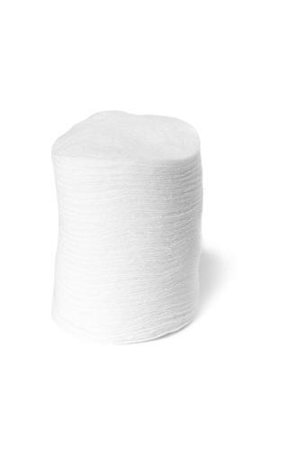 Close-up of cotton disks stack isolated on white background.