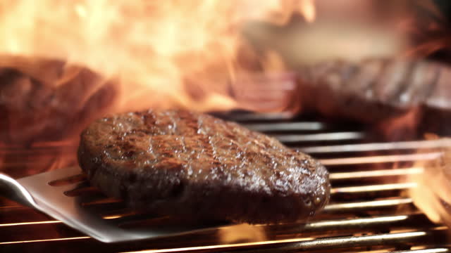 Flames over Beef Patties on BBQ Grill Super Slow Motion
